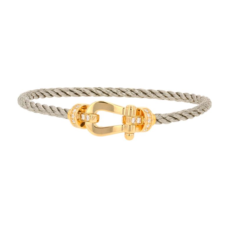 Bracelet or et acier diamant (s) signé FRED