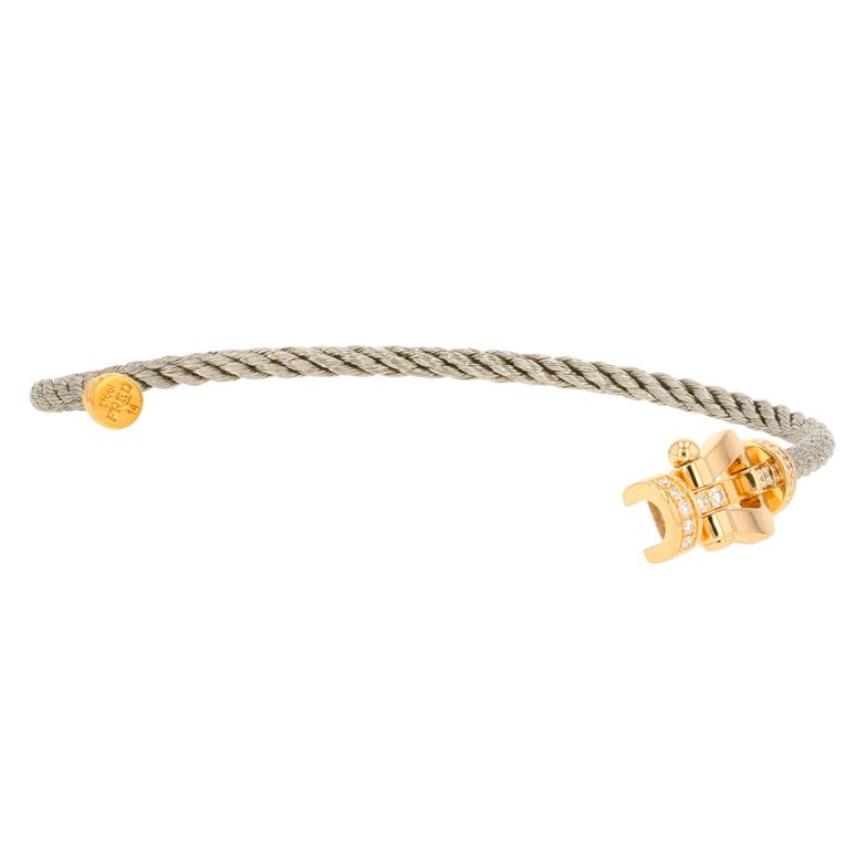 Bracelet or et acier diamant (s) signé FRED